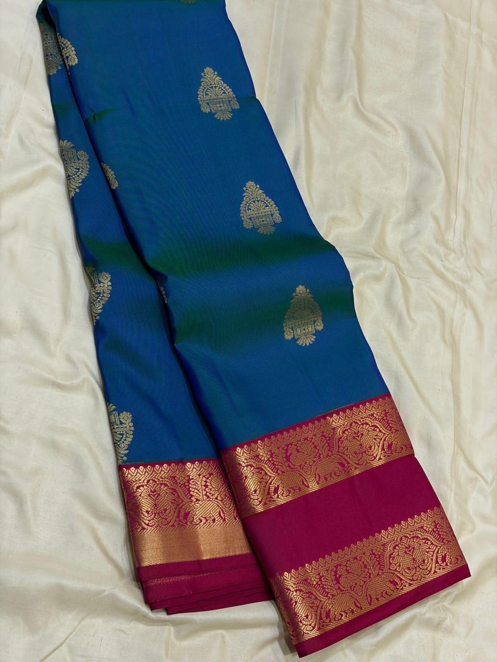 Peacock Blue Kanchipuram Silk Saree with Magenta Korvai Border