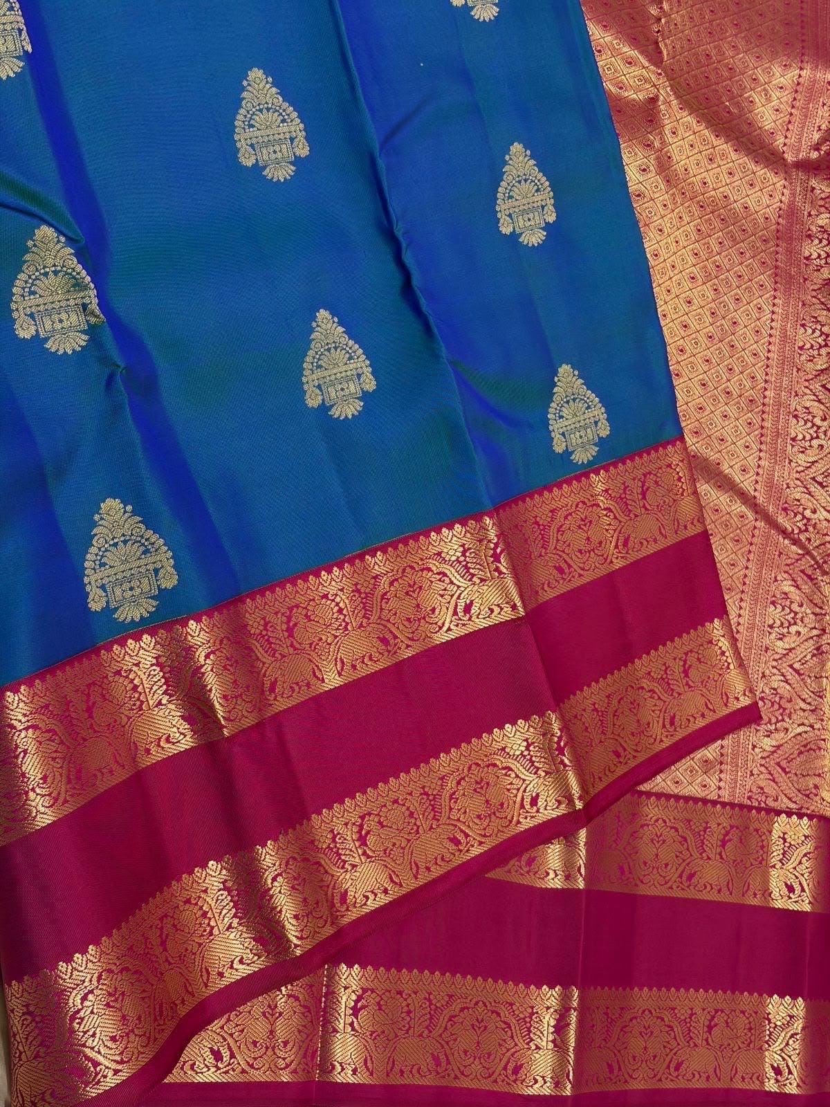 Peacock Blue Kanchipuram Silk Saree with Magenta Korvai Border