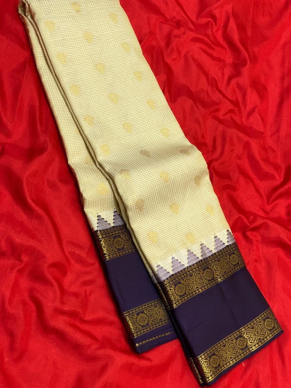 Cream Kanchipuram Silk Saree with Navy Korvai Border