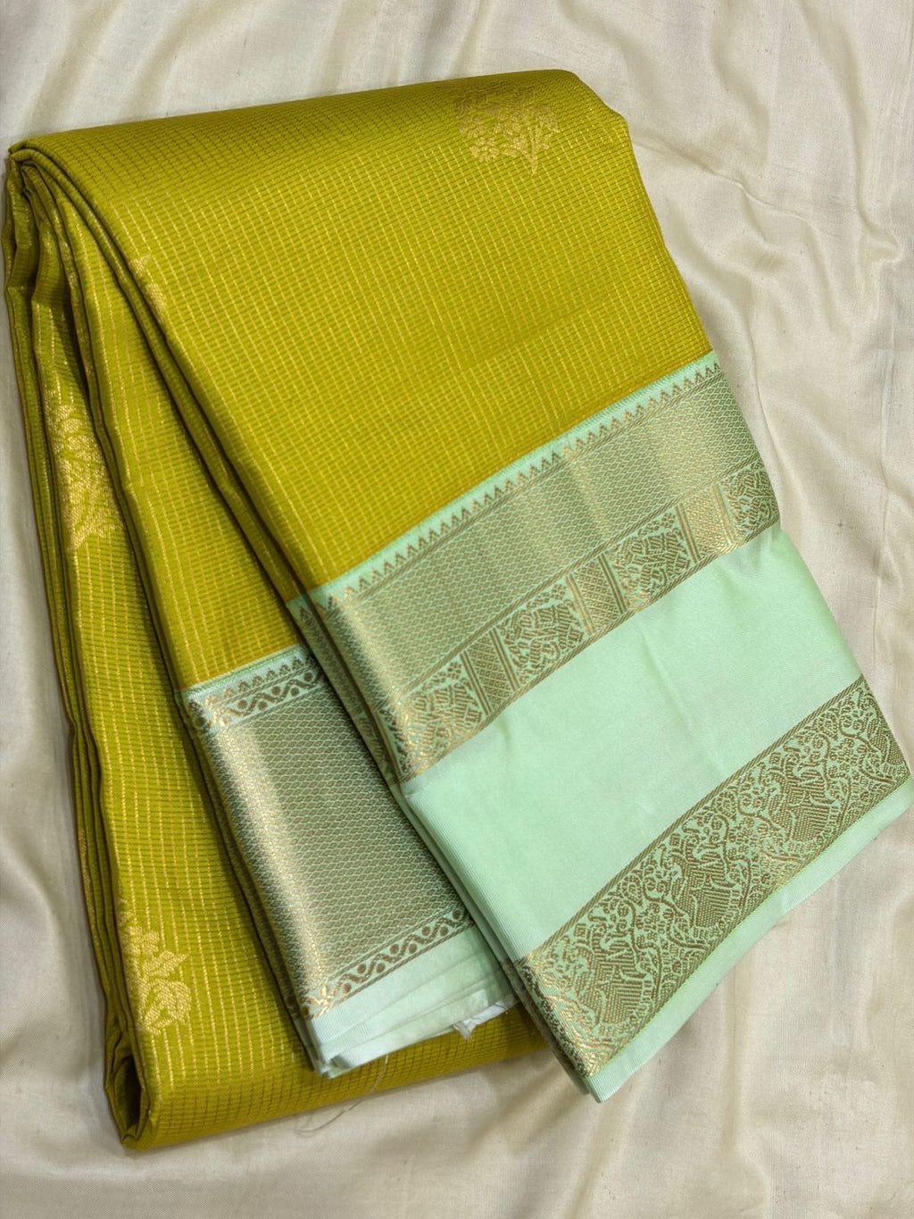 Leaf Green Kanchipuram Silk Saree with Pastel Mint Border